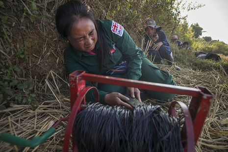 Female deminer at work in Laos