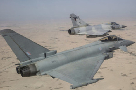 RAF Typhoon (foreground) and a QEAF Mirage jet taking part in a joint exercise held by the Emir of Qatar's Air Force.