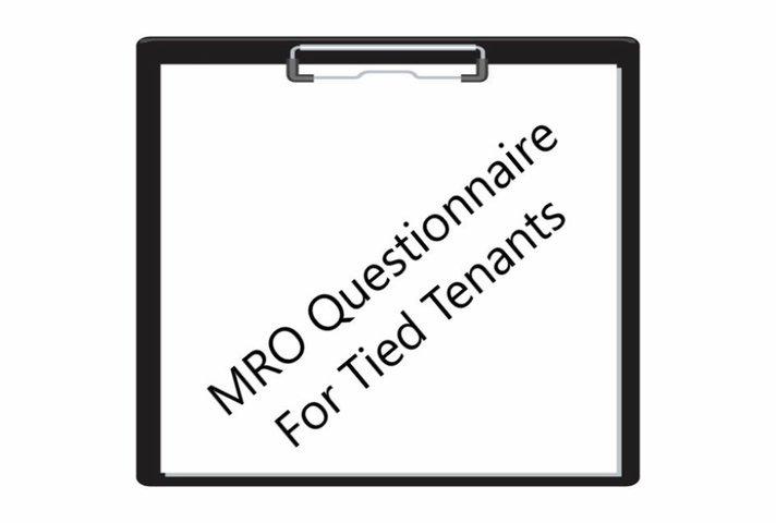 Clipboard with MRO questionnaire written in the middle