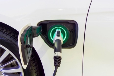 Close up of an electric vehicle being charged