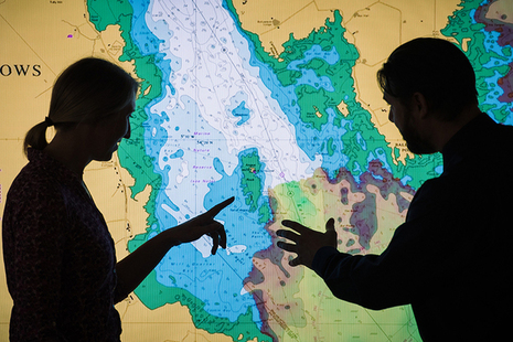 Two users analysing marine geospatial data