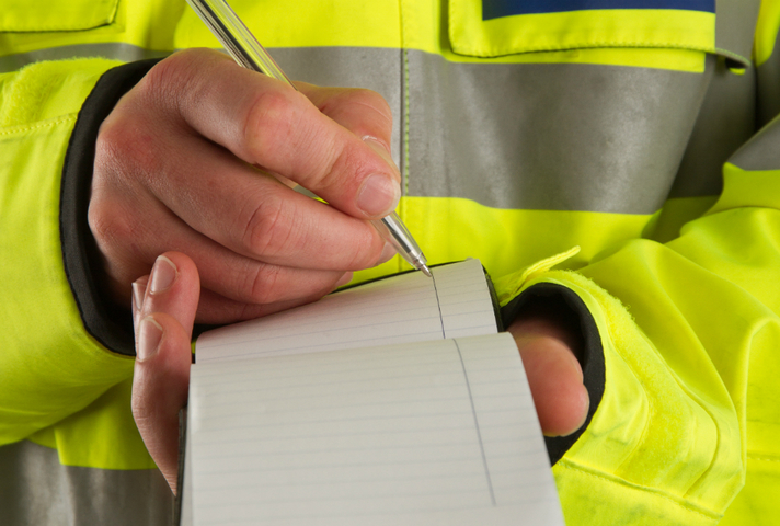 Police officer with notebook