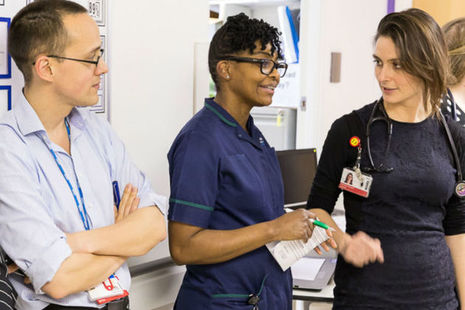 Doctors chatting in hospital corridor