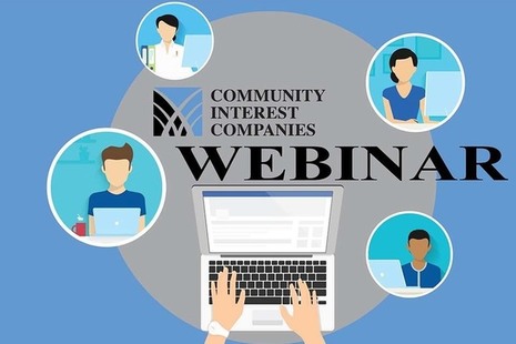 People sitting around a table for a webinar