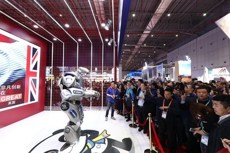 Titan the Robot entertains crowds at the UK pavilion at the Chinese International Import Show