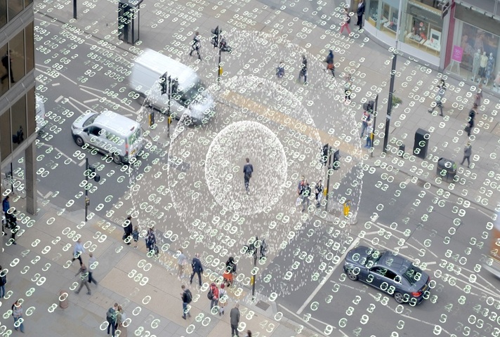 A city square with cars and people with an overlay of transparent data