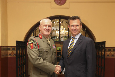 Minister for the Armed Forces Minister Mark Lancaster shakes hands with His Excellency the Governor of Gibraltar