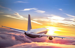 Plane flying over the sunrise