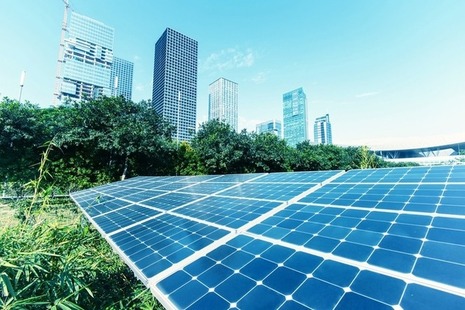 Solar panels in foreground of cityscape