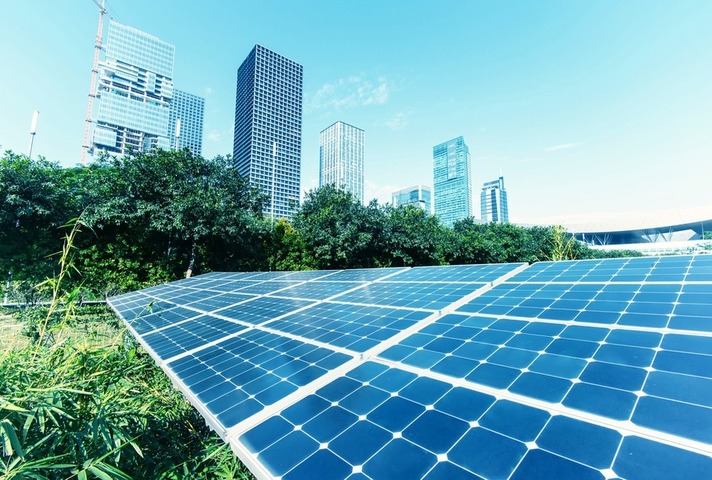Solar panels in foreground of cityscape