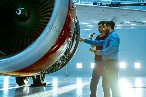 Maintenance engineers diagnose a jet engine