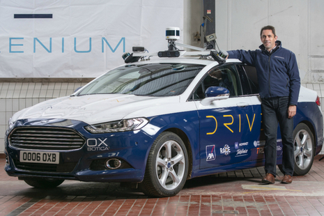 Oxbotica's CEO Graeme Smith with their autonomous vehicles in Oxford