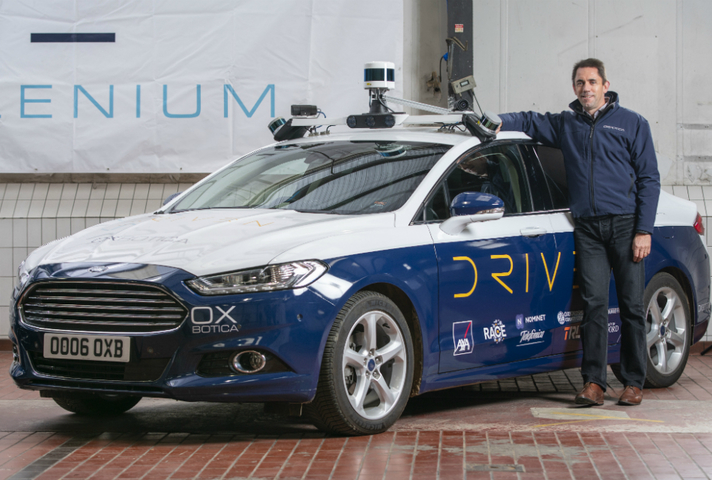 Oxbotica's CEO Graeme Smith with their autonomous vehicles in Oxford