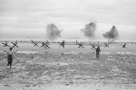 Troops land on a beach at Normandy, 75 years ago. © IWM (A 23993)