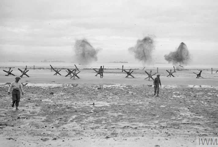 Troops land on a beach at Normandy, 75 years ago. © IWM (A 23993)