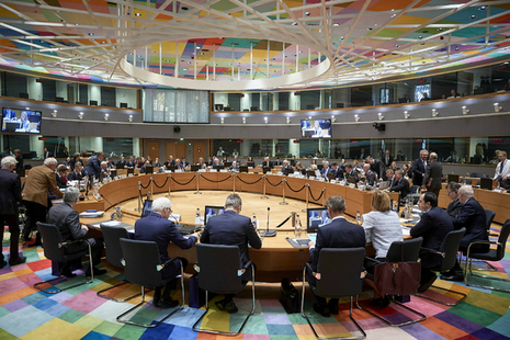 People sat round a table in the EU