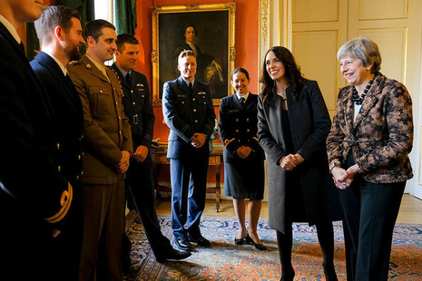 PM Theresa May and PM Ardern meet military personnel