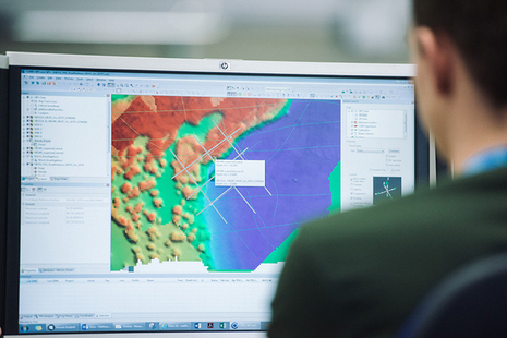 UKHO staff viewing bathymetric data on a monitor