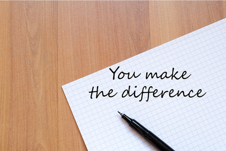 Paper and pen with the words 'you make the difference' written on it.