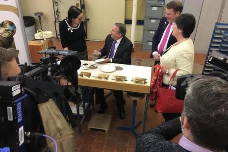 Dr Liam Fox MP with ceramics workers