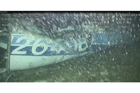 the rear left side of the fuselage including part of the aircraft registration