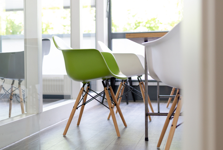 Plastic tub chairs conference table window
