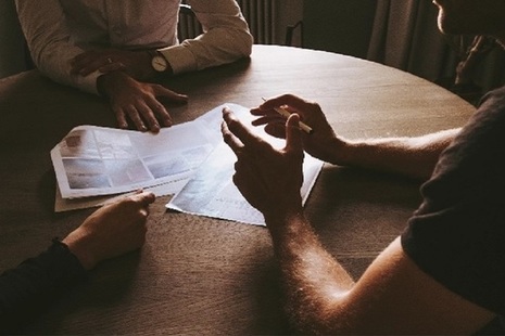Three people sitting at a table