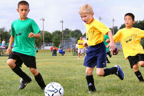 children playing football
