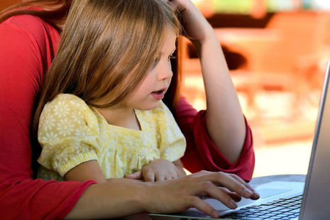 parent and child using a laptop