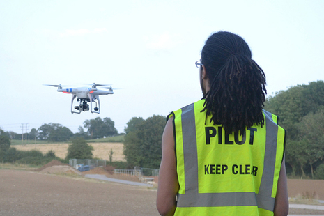 Picture of person flying a drone.