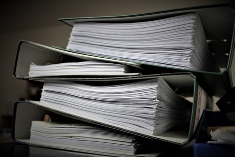 Stacked up file folders full of documents