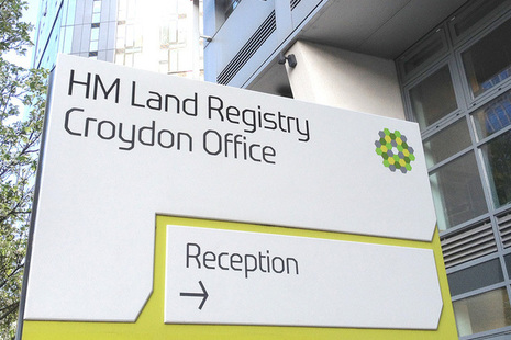 Sign directing people to the the Croydon Office reception.