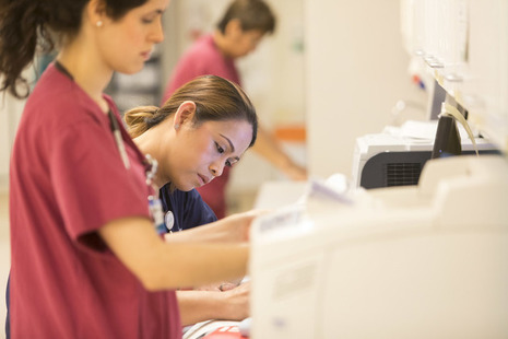 Nurse completing paperwork in hospital