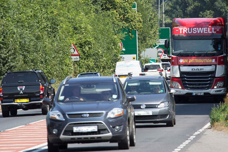 Picture of cars driving on the road.