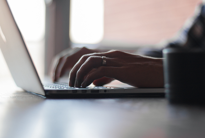 Person typing on laptop