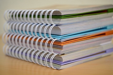 Colourful notebooks stacked up