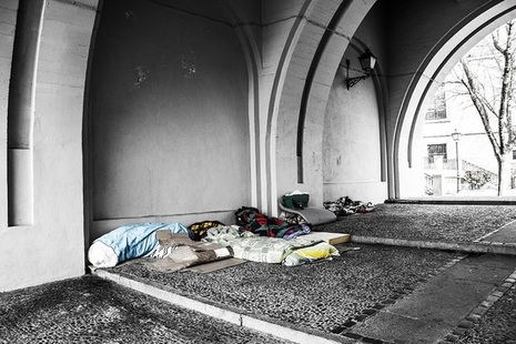 Sleeping bags under a bridge.