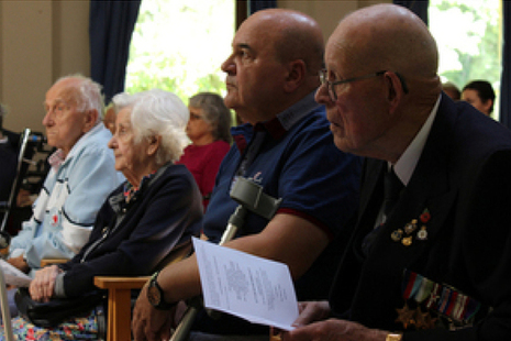 Residents look on during the memorial service.