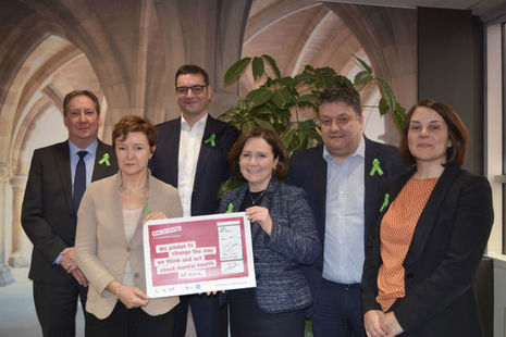 Image of: SLC CEO and Executive Team signing Time to Change Pledge