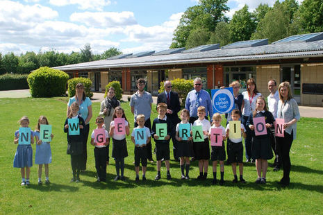 Staff from The Low Carbon Hub with pupils from a school