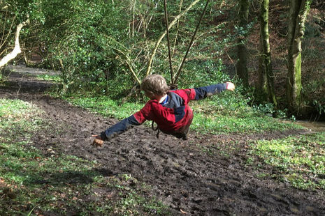 Child sitting on a swing made of rope