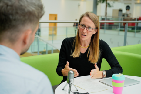 Photograph of woman being intervewed
