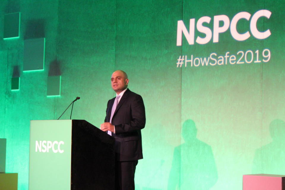 Home Secretary delivering a speech.