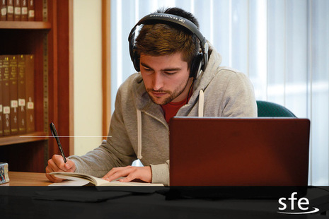 Image of person studying at desk