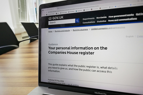 A laptop screen displaying a webpage titled 'Your personal information on the Companies House register'.