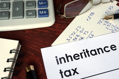 A report entitled Inheritance Tax on a table