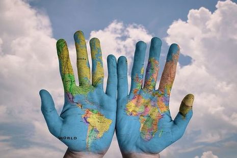 hands with european map printed on them