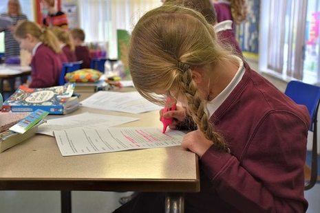 Female pupil writing