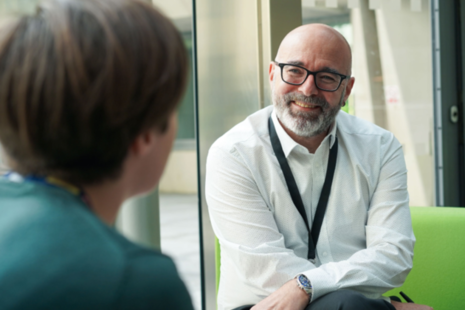 Photograph of Andy Cox being interviewed