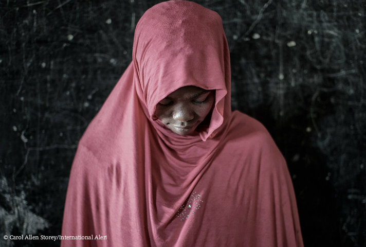 Woman with her head bowed